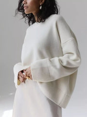 White soft knit sweater with ribbed detailing and crew neck.
