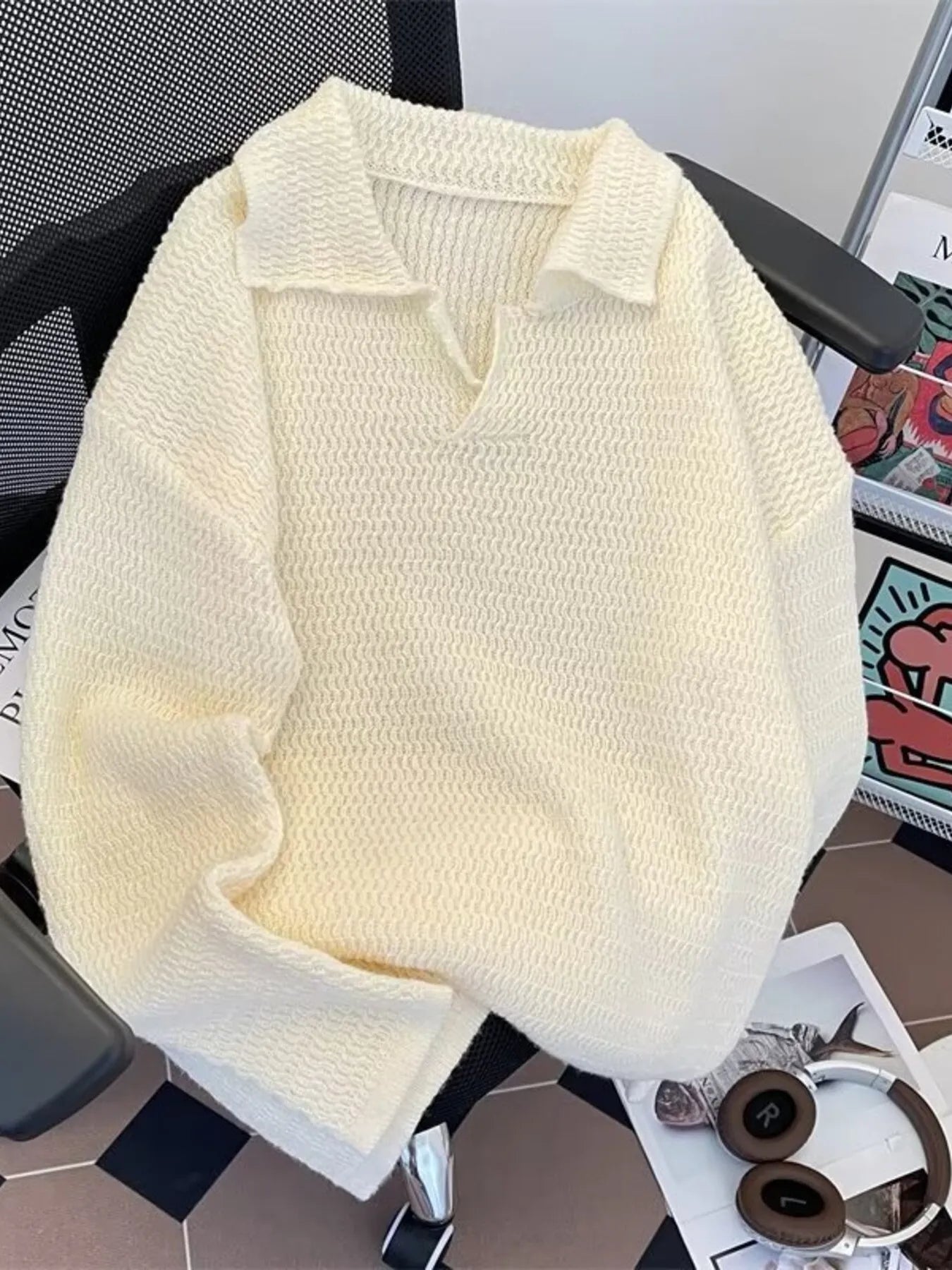 Textured knit polo collar sweater in apricot with a relaxed fit and v-neck.
