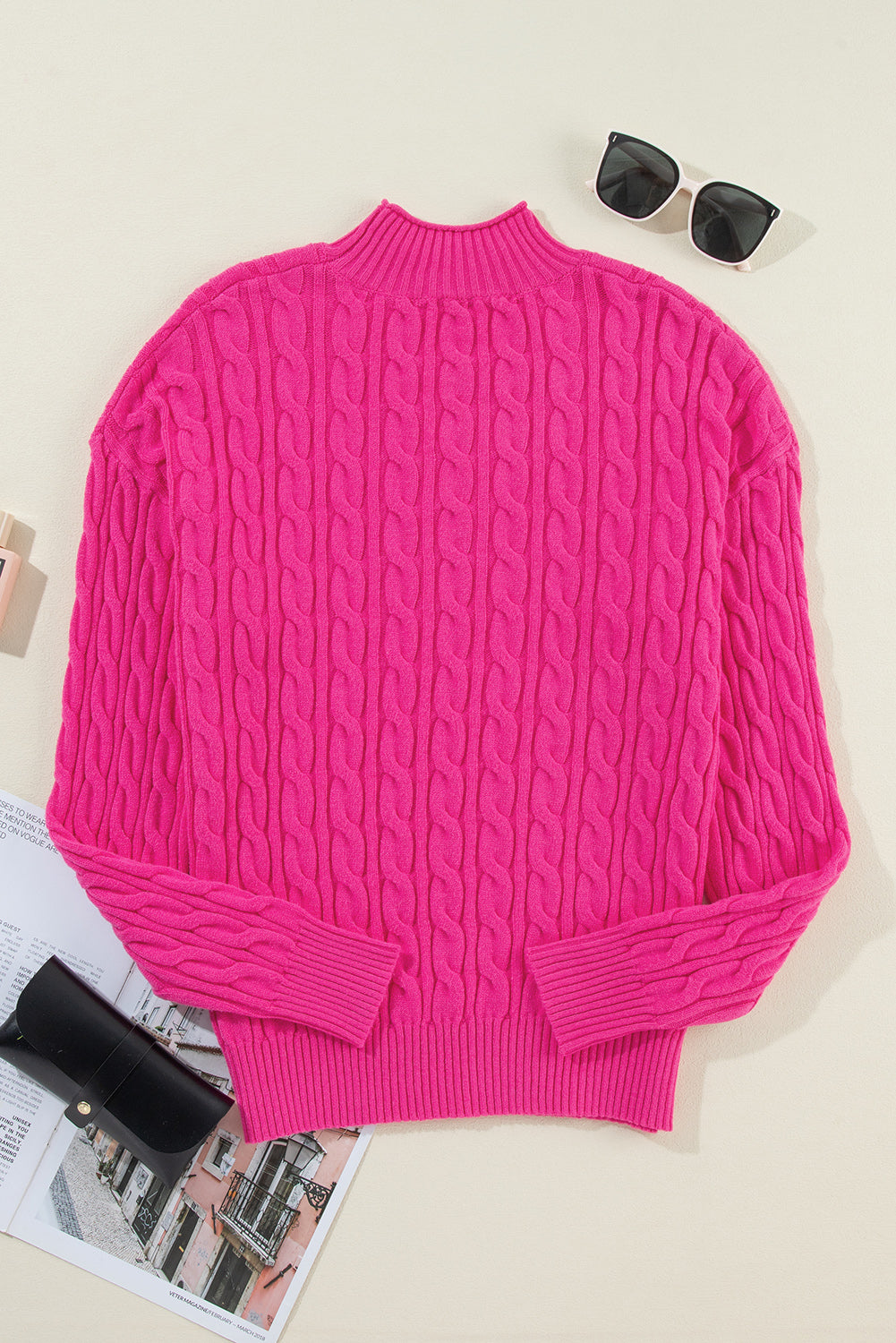 Hot pink cable knit mock neck pullover sweater with ribbed cuffs and hem.