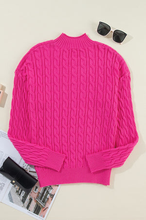 Hot pink cable knit mock neck pullover sweater with ribbed cuffs and hem.
