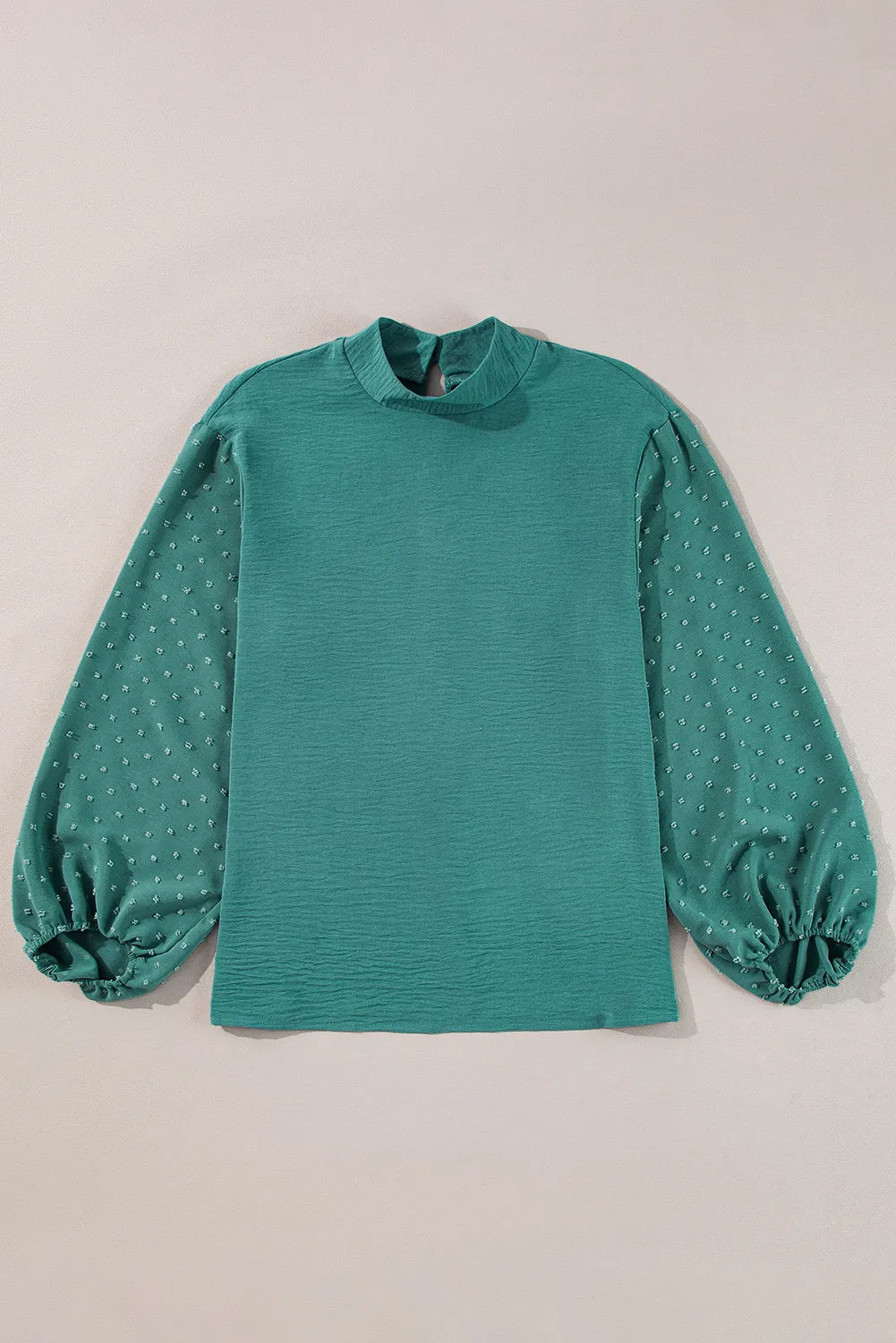 Teal textured blouson top with Swiss dot balloon sleeves and mock neck