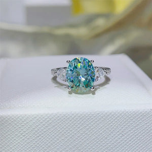 Turquoise oval moissanite trilogy ring in 925 sterling silver with pave accents