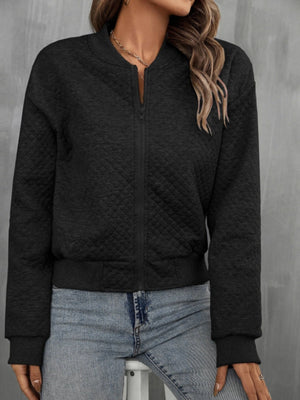 Black diamond quilted bomber jacket with zip front and ribbed cuffs and hem.