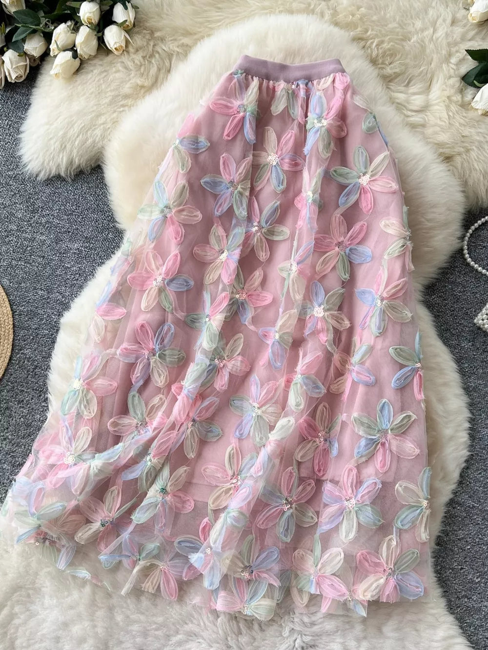 Embroidered floral layered skirt in pink with pastel flowers and sequin details.