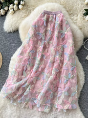 Embroidered floral layered skirt in pink with pastel flowers and sequin details.