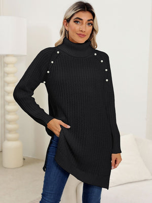 Black ribbed turtleneck tunic with pearl embellishments on shoulders, side slits, and a comfortable fit.