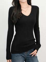 Black ribbed V-neck fitted knit sweater with long sleeves.