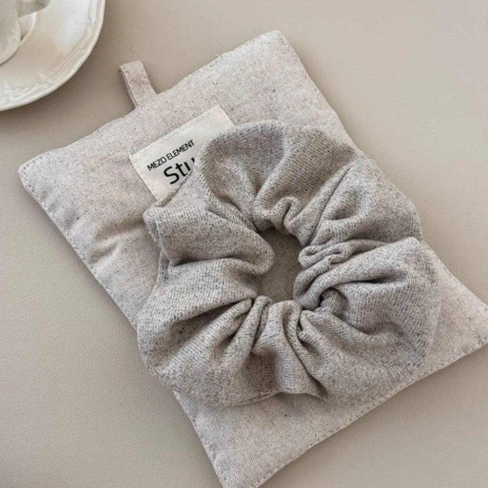 Textured knit scrunchie in Style A, soft and comfortable hair accessory.