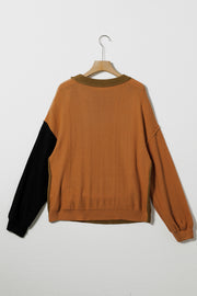 Brown acrylic sweater with black and olive green contrast sleeves and neckline.