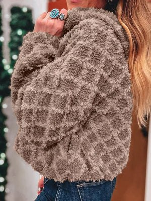 Textured sherpa fleece hooded jacket in brown with a diamond pattern, shown on a woman.