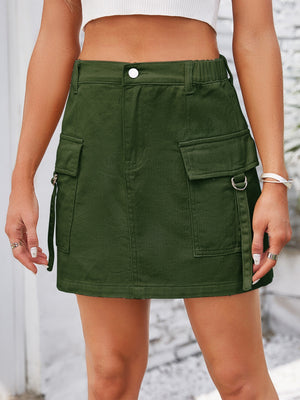 Army green denim mini skirt with utility pockets and D-ring details.