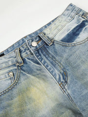 Men's blue wide leg denim jeans with distressed wash and yellowing details.