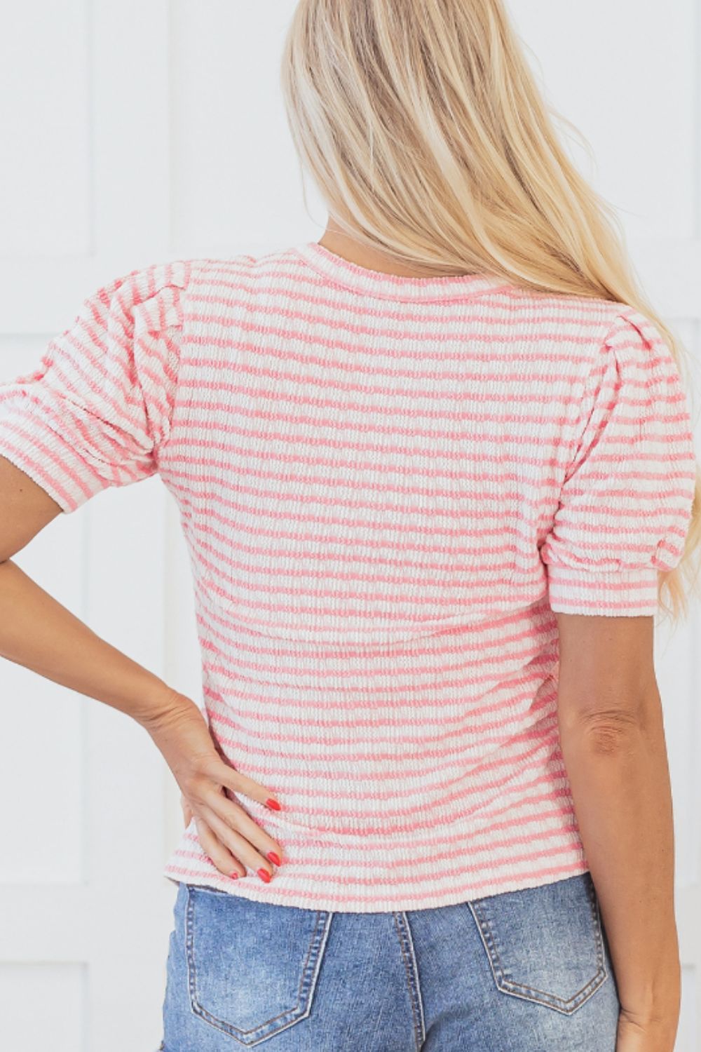 Textured stripe puff sleeve top in blush pink with a textured knit fabric.