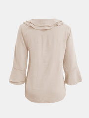 Ruffled linen blouse in Dust Storm with flared sleeves and textured fabric.