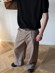 Mocha high-waisted wide leg pants with button detail and a belt.
