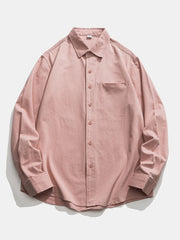 Classic button-down men's shirt in pink cotton with a chest pocket.