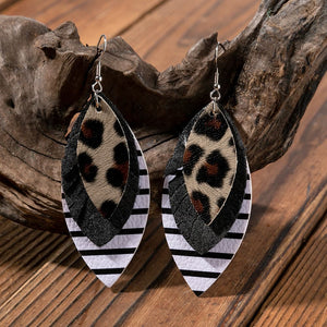 Layered faux leather statement earrings with leopard print, black, and stripe patterns.