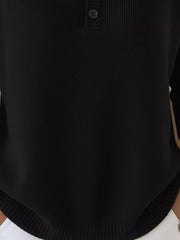 Black long-sleeve knit top with button detail at the neckline.