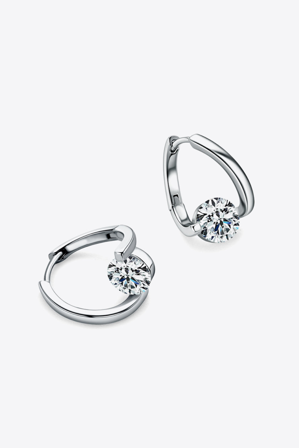 Silver hoop earrings with a single round-cut diamond accent.