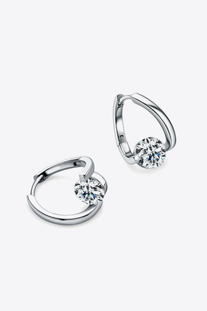 Silver hoop earrings with a single round-cut diamond accent.