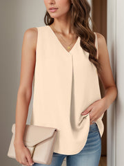 Sleeveless V-neck blouse in light peach with front pleats.
