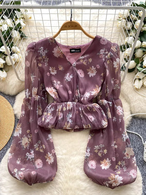Purple floral chiffon blouse with V-neck, balloon sleeves, and peplum waist.