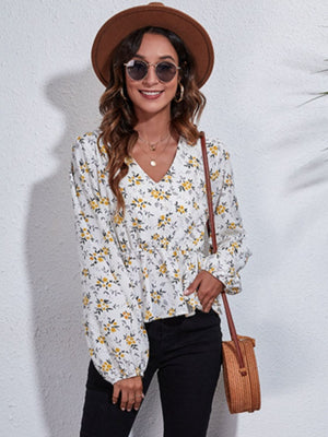 White floral peplum blouse with v-neck and gathered waist