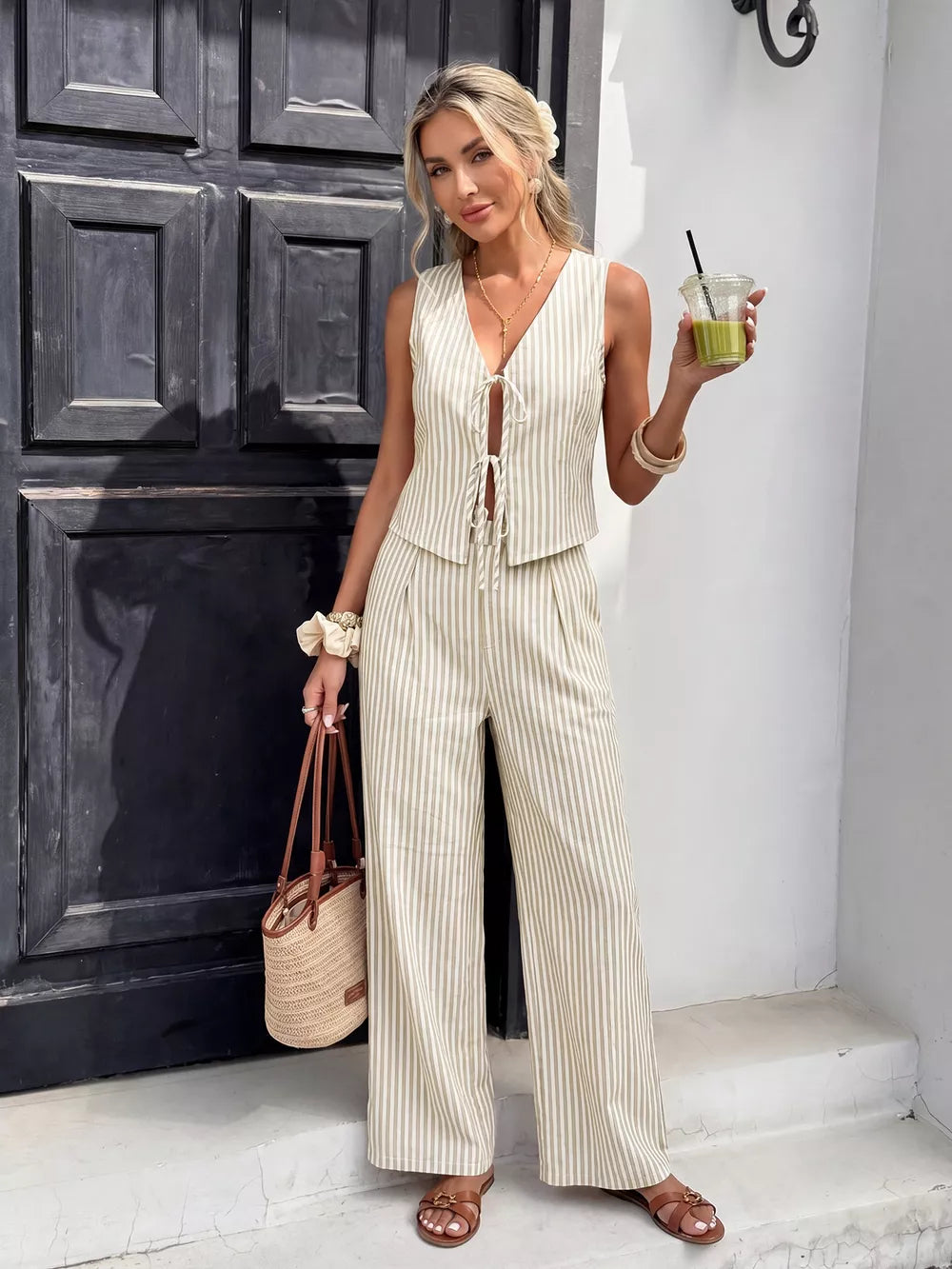 Chic striped two-piece set with tie-front vest and wide-leg pants.