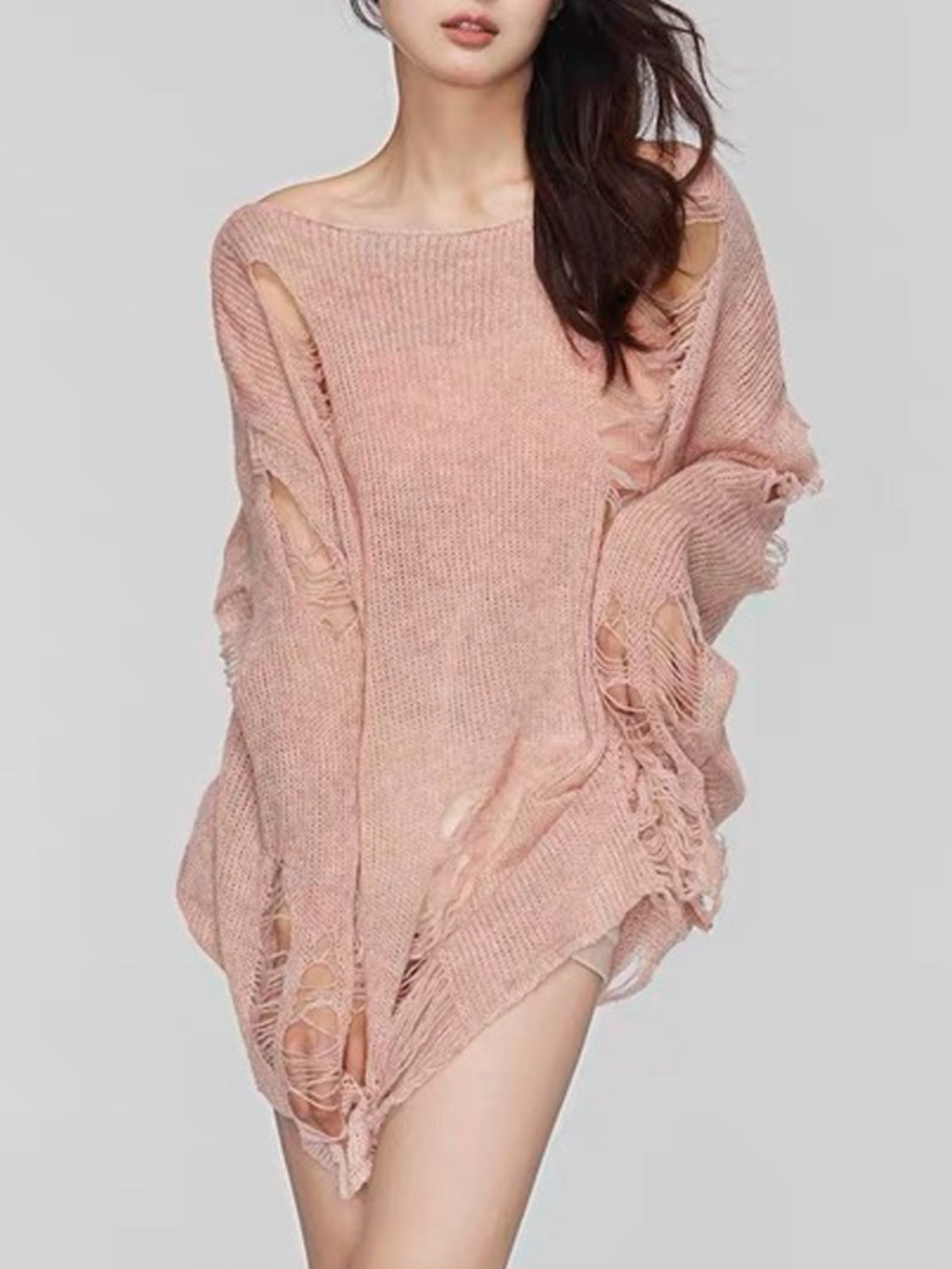 Ripped knit oversized beach pullover in watermelon pink with boat neck and distressed details.