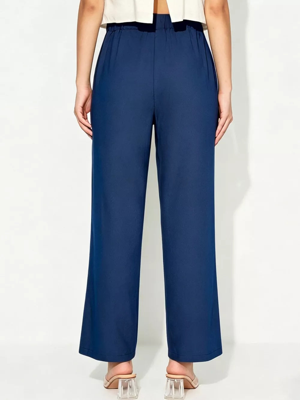 Blue maternity pants with relaxed wide legs and tied detail waist
