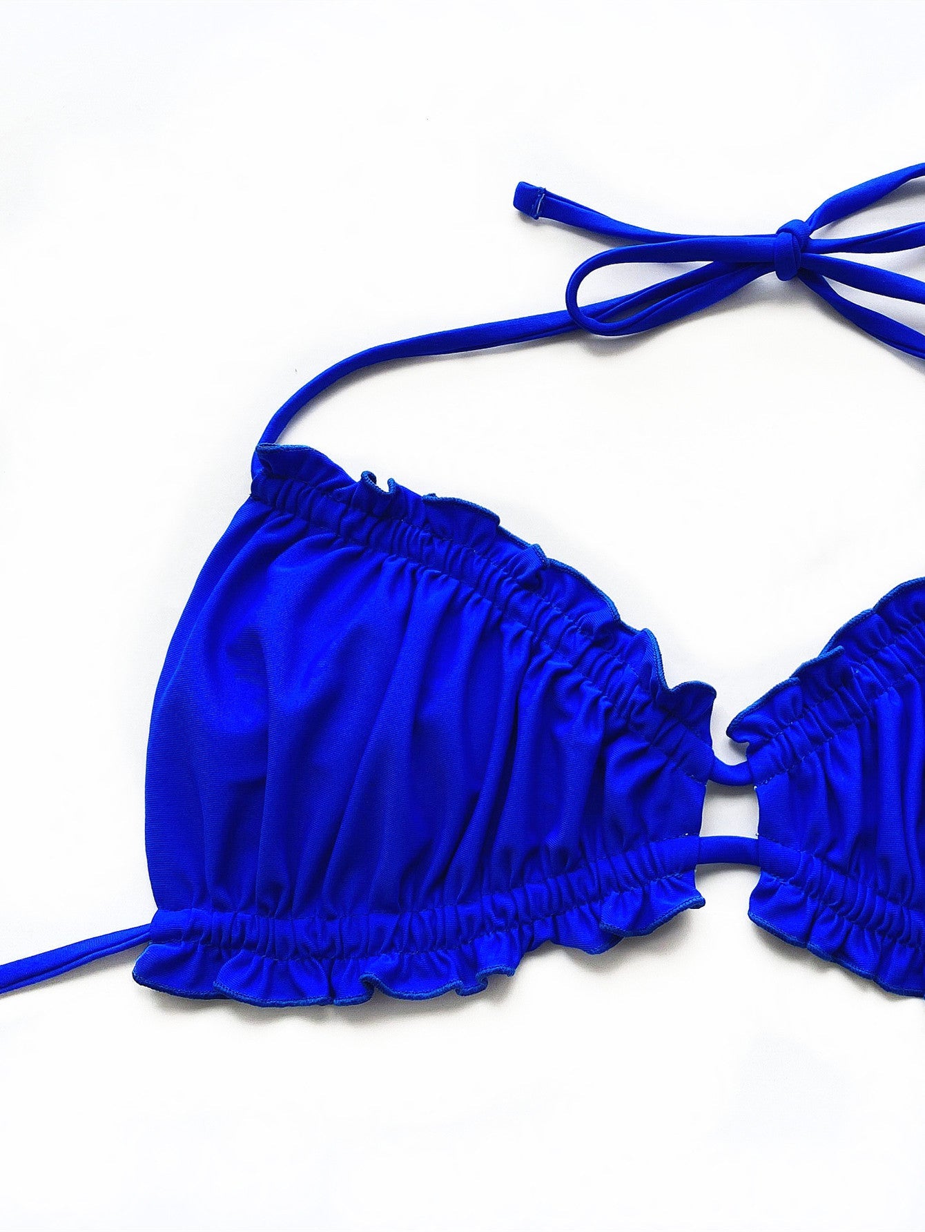 Royal blue ruffled tie bikini top with adjustable straps and a center ring detail.