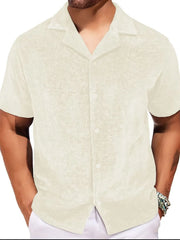 Textured velour camp collar shirt in ivory with short sleeves and button front.