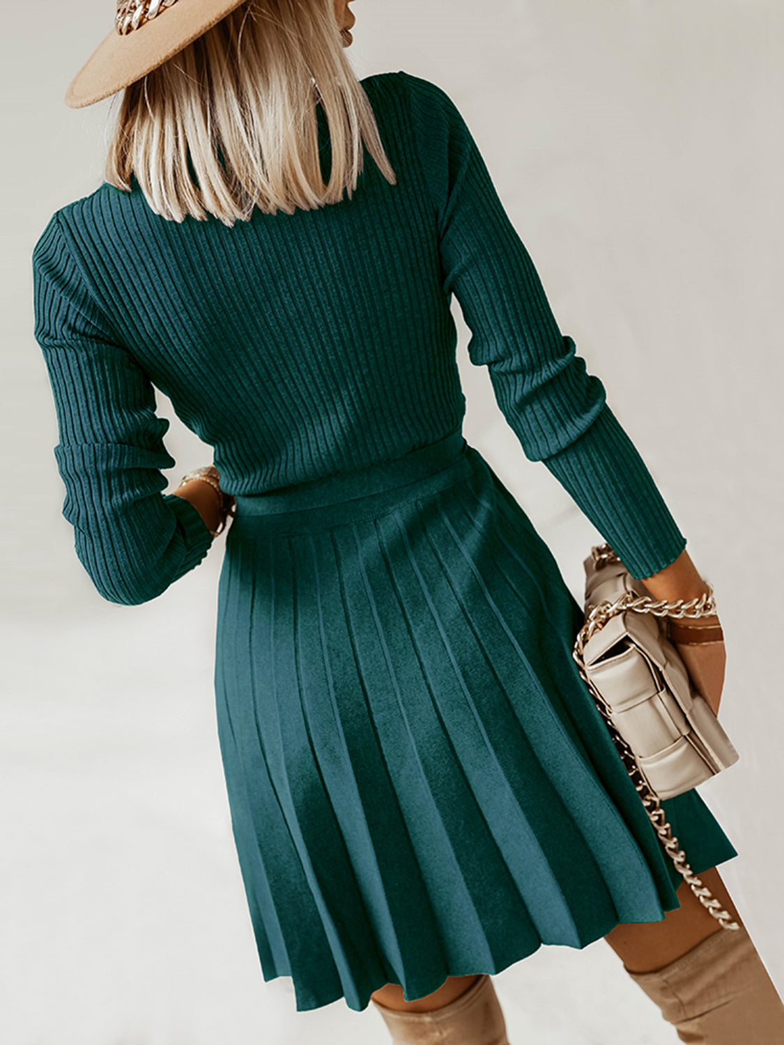 Ribbed knit wrap dress in army green with a pleated skirt and long sleeves.