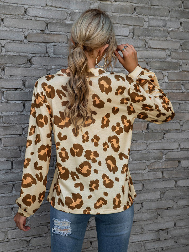 Leopard print blouse in brown with blouson sleeves and a collared neckline.