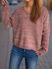 Textured slouch v-neck sweater in dusty pink with multi-color flecks, acrylic knit.