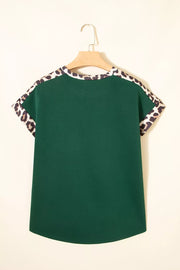 Green relaxed fit tee with leopard print trim on sleeves and neckline.