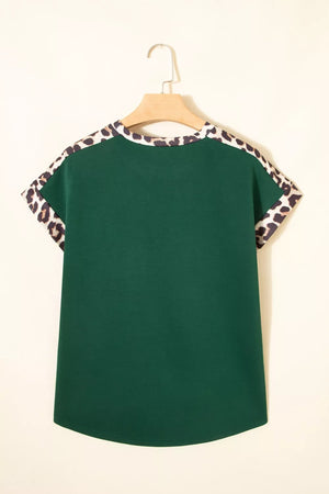 Green relaxed fit tee with leopard print trim on sleeves and neckline.