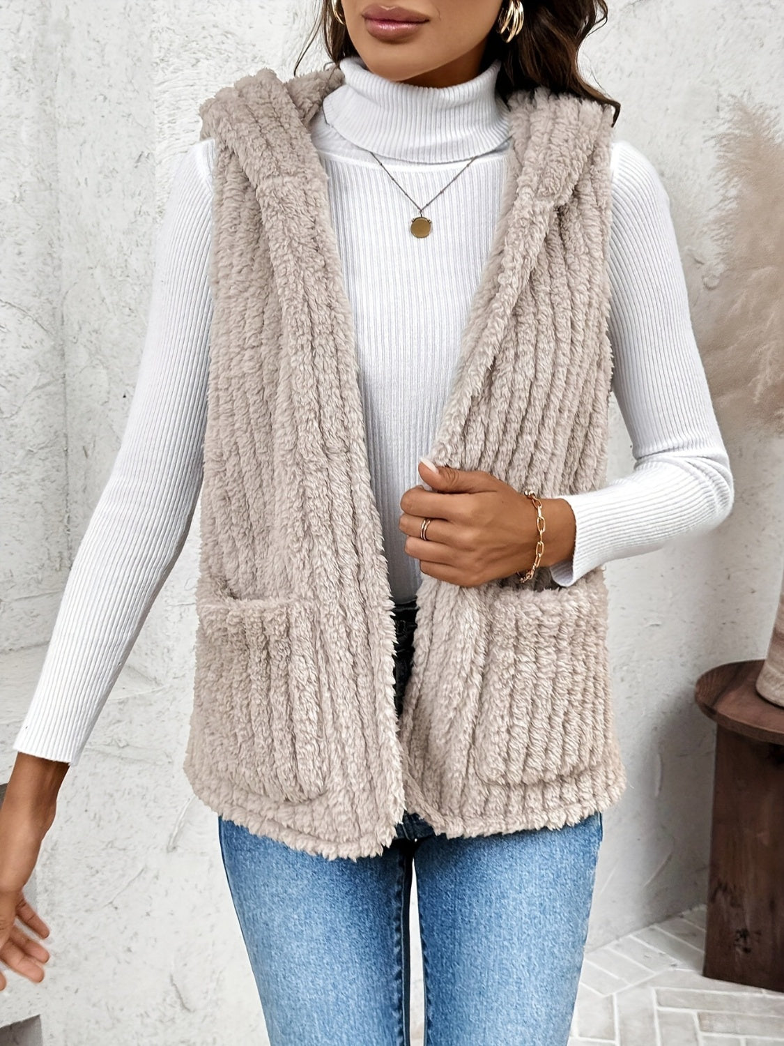 Textured teddy hooded vest in Dust Storm with two front pockets.