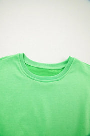 Lime green cotton crewneck sweatshirt with ribbed collar and cuffs.
