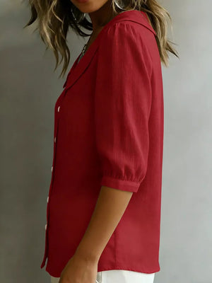 Red button-down shirt with Peter Pan collar and 3/4 sleeves.