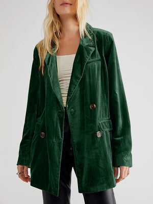 Dark green velvet double-breasted blazer with patch pockets and button closure.