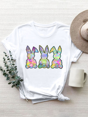 White t-shirt with three pastel bunny silhouettes featuring a colorful, textured pattern.