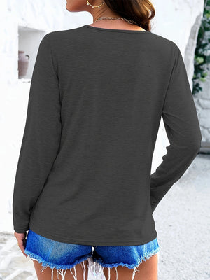 Dark gray long sleeve tee with a textured fabric and round neckline.