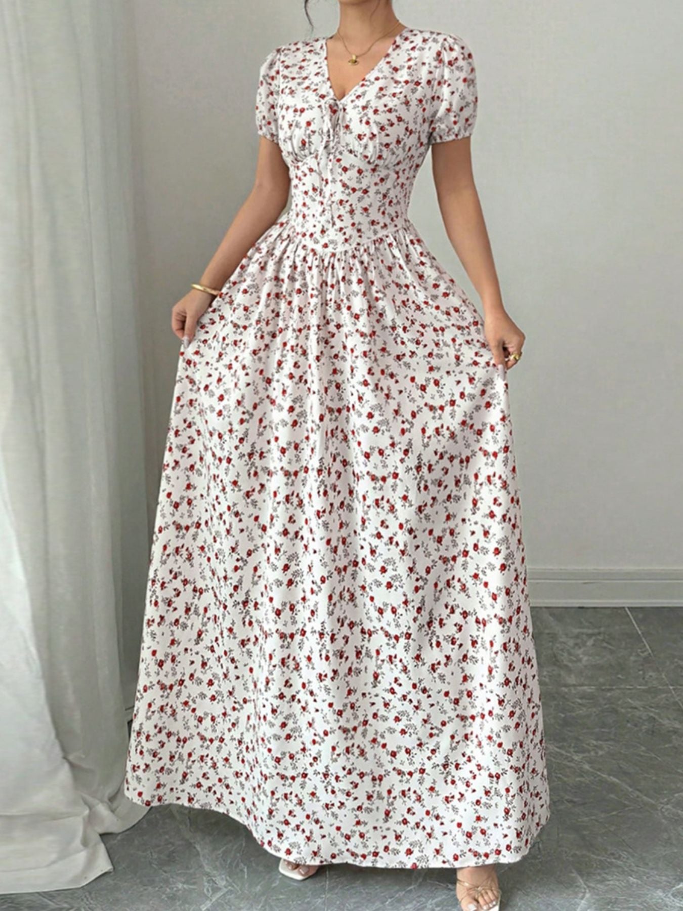 Maxi dress with V-neck, short sleeves, and a white floral print.