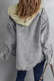 Gray corduroy hooded utility jacket with distressed hem and contrast hood.
