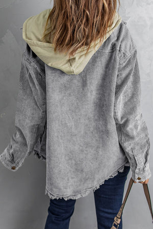 Gray corduroy hooded utility jacket with distressed hem and contrast hood.
