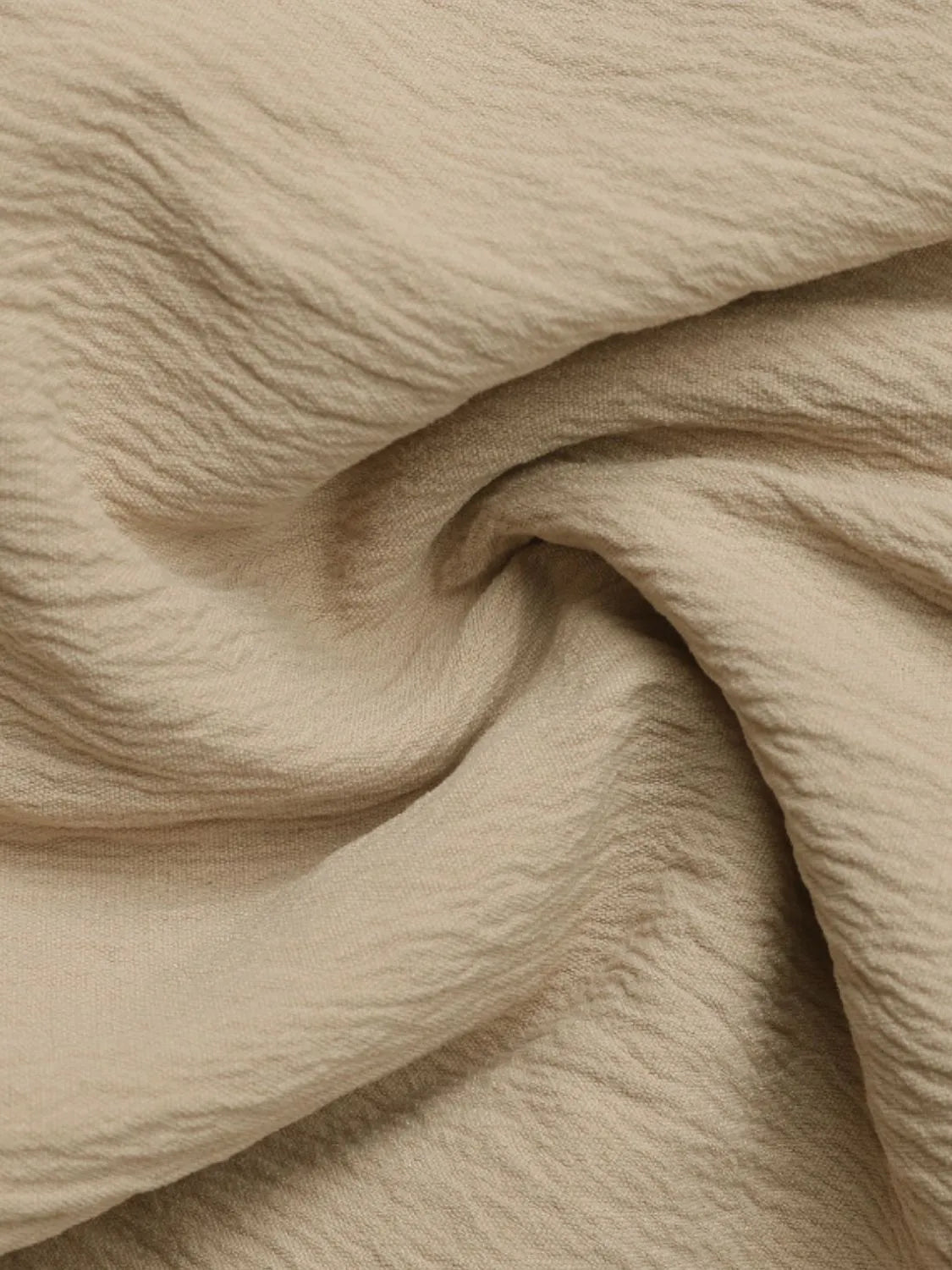 Tiered ruffle mini skirt in tan fabric with crinkled texture