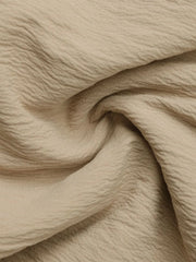 Tiered ruffle mini skirt in tan fabric with crinkled texture