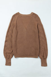 Taupe acrylic knit cardigan with diamond-cut sleeves and ribbed cuffs.