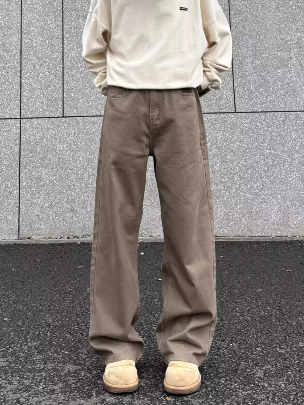 Men's brown wide-leg sweatpants with a relaxed fit and elastic waistband.